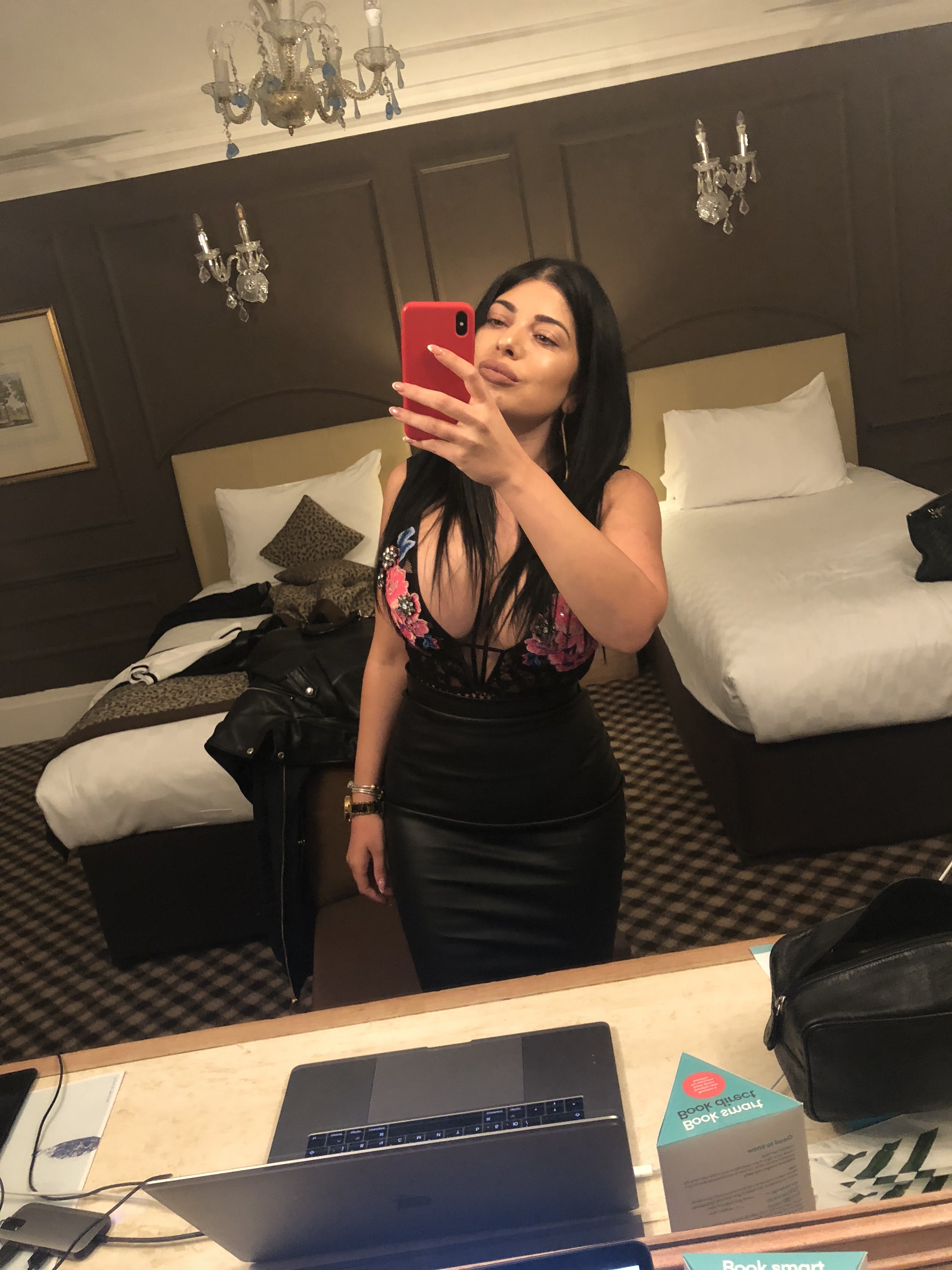 Hot selfie of Monica in a tight black dress