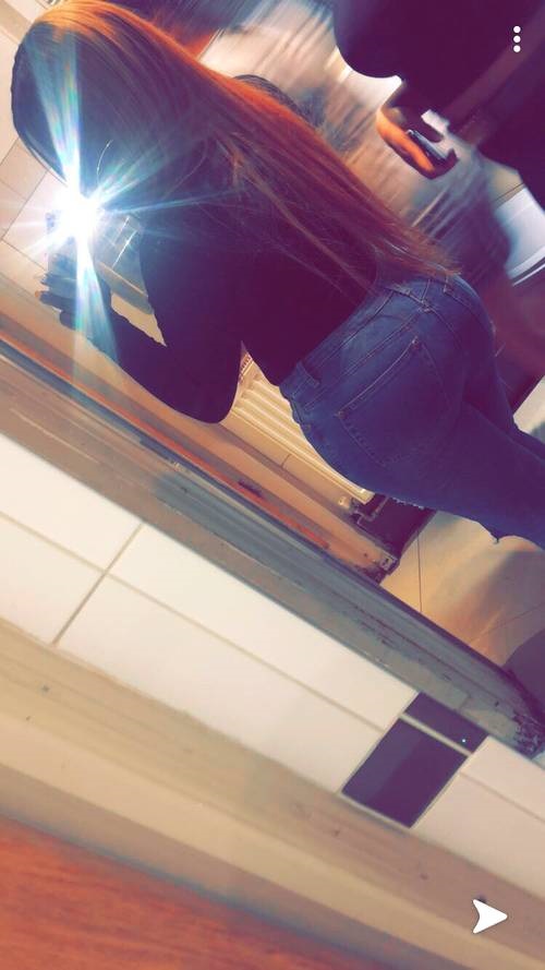 Sian taking a selfie in the mirror showing off her huge bum in jeans